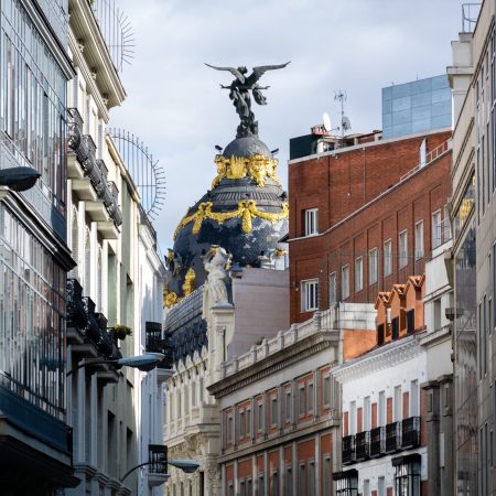 A closeup shot of a dome with Victoria statue, Metropolis Building, Madrid, Spain